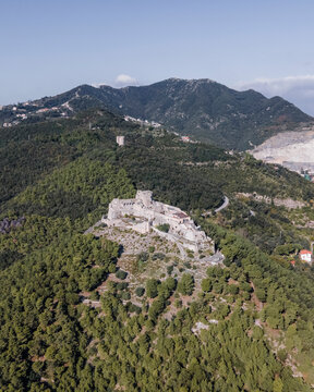 Aerial view of Arechi Castle surrounded by mountains and forest, Salerno, Italy.