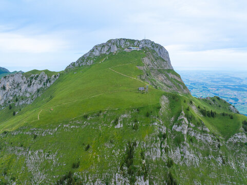 Aerial view of Stockhorn Mountain with scenic green hills and rocky trails, Erlenbach im Simmental, Switzerland.