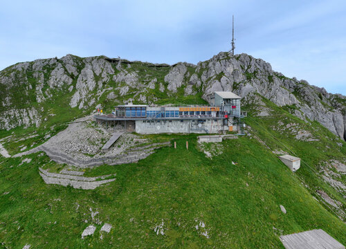 Aerial view of Stockhorn peak with rugged terrain and a cable car station, Erlenbach im Simmental, Switzerland.