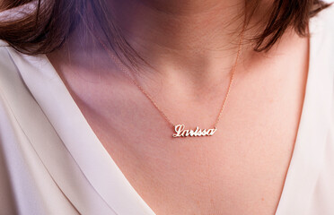 Name necklace on young woman