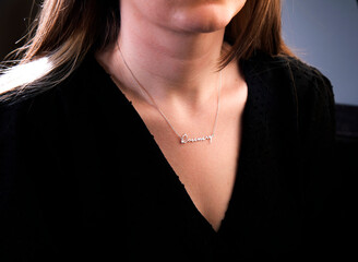 Name necklace on young woman