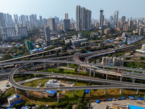 Aerial view of modern skyline with high rise buildings and Atal Setu bridge over the Arabian Sea, Sewri, Mumbai, India.