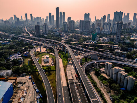 Aerial view of modern buildings and infrastructure with Atal Setu over the Arabian Sea, Sewri, Mumbai, India.