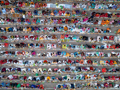 Sonargaon, Bangladesh - 09 November 2024: Aerial view of a colorful gathering of devotees in prayer at a mosque during Ramadan, Baradi, Bangladesh.
