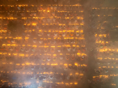Aerial view of a vibrant festival with lights surrounding an ancient temple, Sonargaon, Bangladesh.
