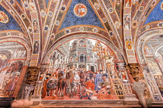 Siena, Italy - June 22, 2024: Siena: Santa Maria della Scala Hospital. Fresco by Domenico di Bartolo: Construction of the foundations of the walls of the hospital (1443).