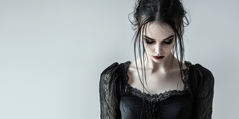 Fototapeta premium Sad Young Woman in Black Lace Dress, Studio Portrait