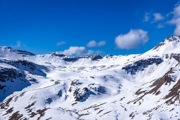 Snow cladded mountain view enroute Rupin pass trekking trail. It is a high altitude trek in Himachal Pradesh located at 4650m with Himalayan ranges, glacial meadows and snow-covered landscapes.