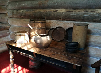 Interior of an old house with a wooden table and   utensils