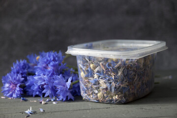 Dried cornflower flowers in closed plastic container