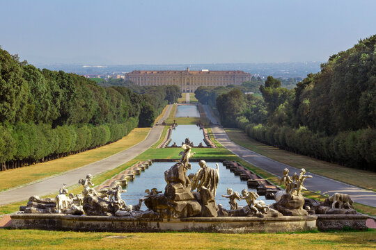 View of the grand Royal Palace of Caserta with elegant gardens and majestic sculptures, Caserta, Italy.