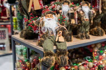 Festive folklore  santa claus figurine in ornate display in the store. Quaint scandinavian-style...