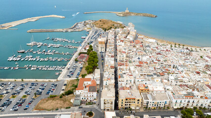 Aerial view of the port and the old town of Vieste, in Puglia, Italy. Beautiful panorama of this...