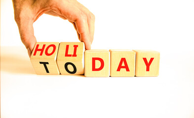 Today is holiday symbol. Concept word Today and Holiday on wooden cubes. Businessman hand....