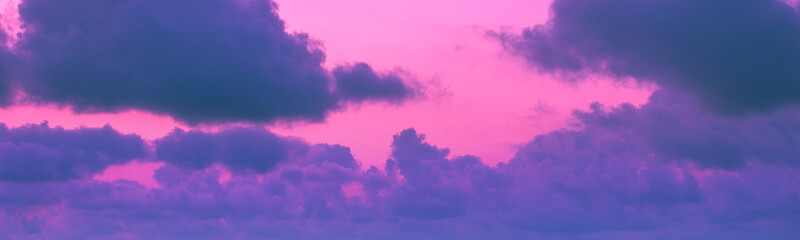 Obraz premium Colorful cloudy sky at sunset. Gradient color. Sky texture. Abstract nature background. Horizontal banner