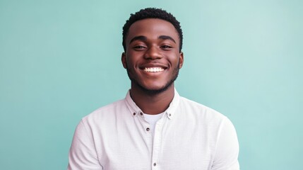 Obraz premium Portrait of a young professional man smiling confidently against a plain colored background, minimalist portrait,