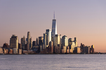Fototapeta premium Manhattan skyline, southern part, during sunset seen from NJ.
