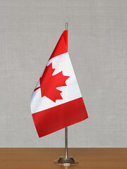Canada table flag on gray blurred background