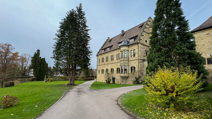 A large house with a driveway leading to it