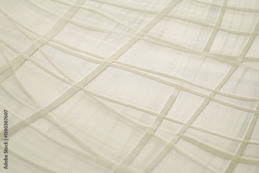 Poster translucent fabric with intersecting lines creates a soft, textured background, conveying elegance a
