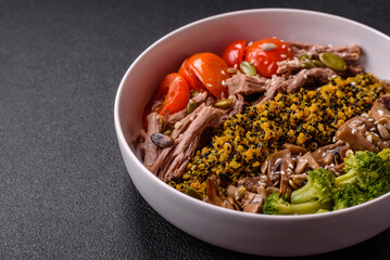 Fototapeta premium Quinoa bowl with tofu, steamed vegetables, grains, seeds and spices