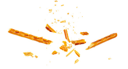 Broken salty cracker pretzel sticks stuffed with peanuts and crumbs isolated on white
