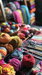 Creative Knitting Workspace Featuring Yarn Balls, Tools, and Colorful Completed Accessories