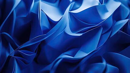 Detailed close-up of vibrant blue fabric, showcasing intricate folds and textures, evoking a sense of fluidity and movement.