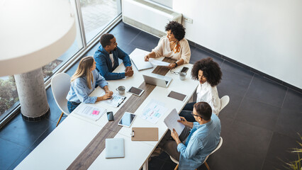 Diverse Team Collaborating During a Productive Meeting