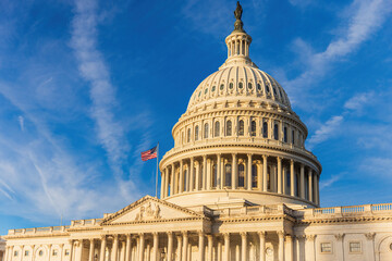 Obraz premium The exterior of the US Capitol Building which houses the Senate and the House of Representatives in Washington DC.