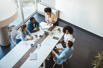 Diverse Team Collaborating in Modern Office Environment