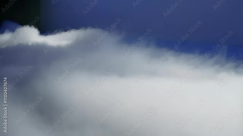 Aufkleber layers of translucent white and gray mist flow and overlap in gentle horizontal motions, evoking a s