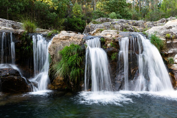 Obraz premium Picturesque view of a waterfall in the forest in Loureza - Galicia
