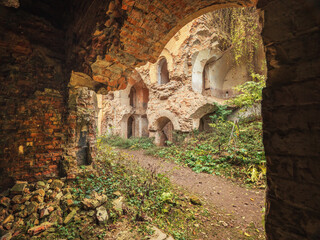 Fototapeta premium view to ruins of old defence fortress under arc