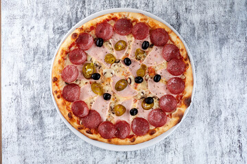fresh pizza on the white plate