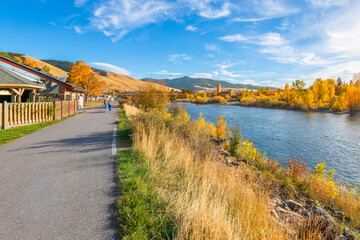 View from the Riverfront Trail along the Clark Fork River of the University District and tower of...