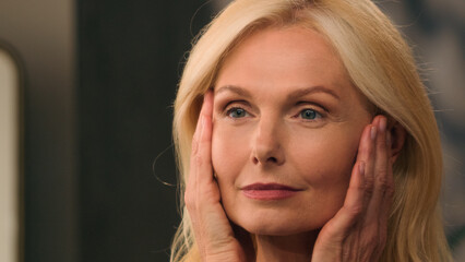 Close up face Caucasian beautiful woman middle aged mature 50s old lady happy female beauty looking...