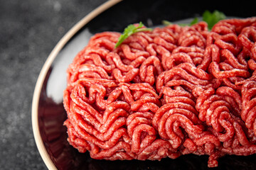 Obraz premium minced meat fresh beef, pork meat tasty eating cooking meal food snack on the table copy space food background rustic top view