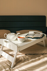 Open Bible and cup of tea, morning prayer concept