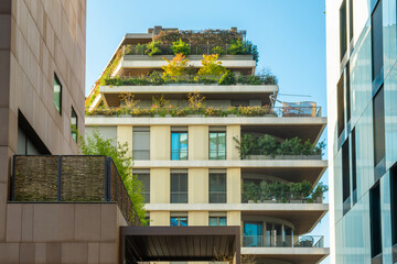 Contemporary building with greenery covered terraces with modern urban architecture, eco-friendly...