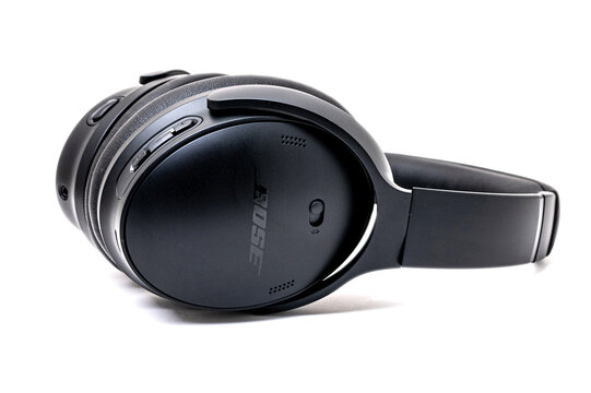 High-quality Bluetooth headphones by American company Bose with active noise canceling on a white background.