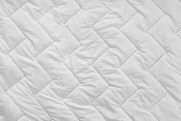 Quilted clean white blanket as background