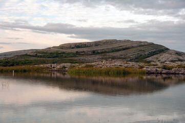 A mountain with a lake in front of it