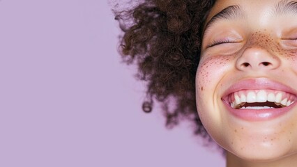 Close-Up of a Biracial Teenage Girl with Freckles and Joyful Expression on Pale Lavender Background