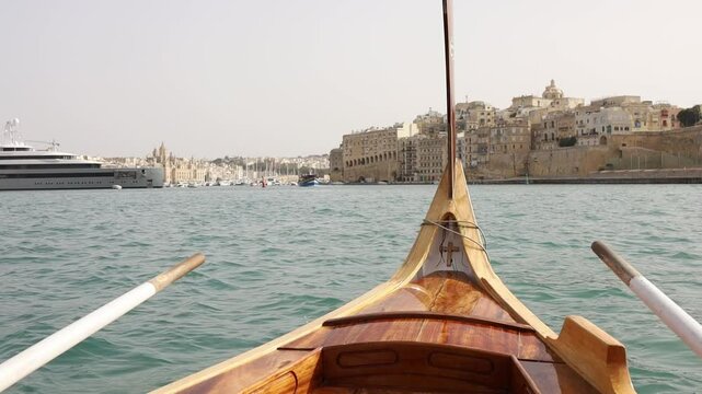 View from authentic traditional maltese boat during trip from Valletta to Birgu