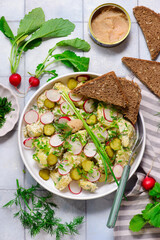 Scandinavian potato salad with gherkins and pollock caviar.