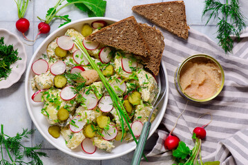 Scandinavian potato salad with gherkins and pollock caviar.