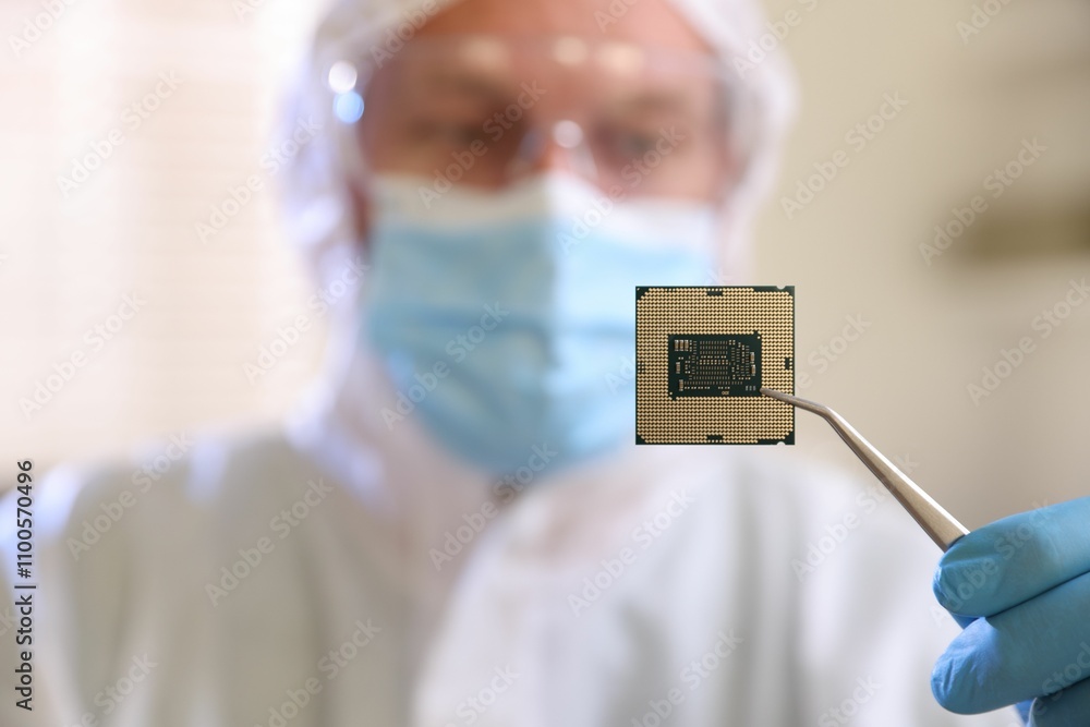 Poster man in mask holding computer chip on blurred background, selective focus