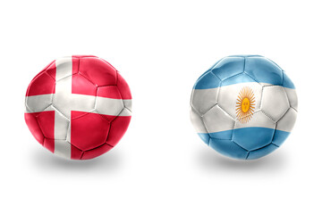 Obraz premium football balls with national flags of denmark and argentina ,soccer teams. on the white background.