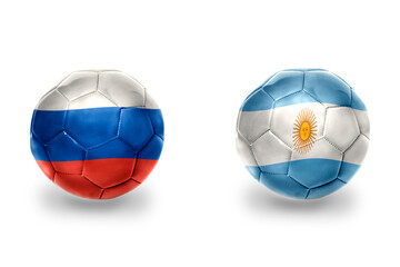 Fototapeta premium football balls with national flags of russia and argentina ,soccer teams. on the white background.